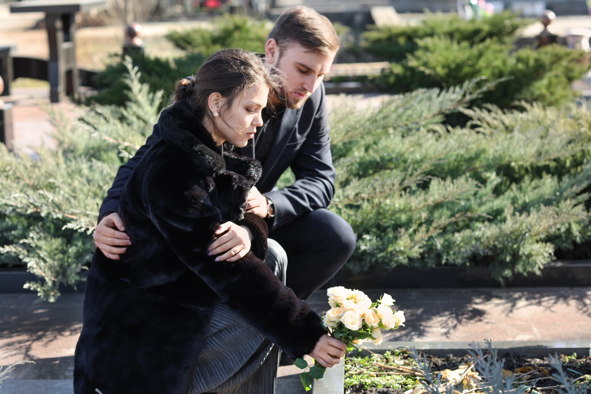 Placing Flowers on Grave