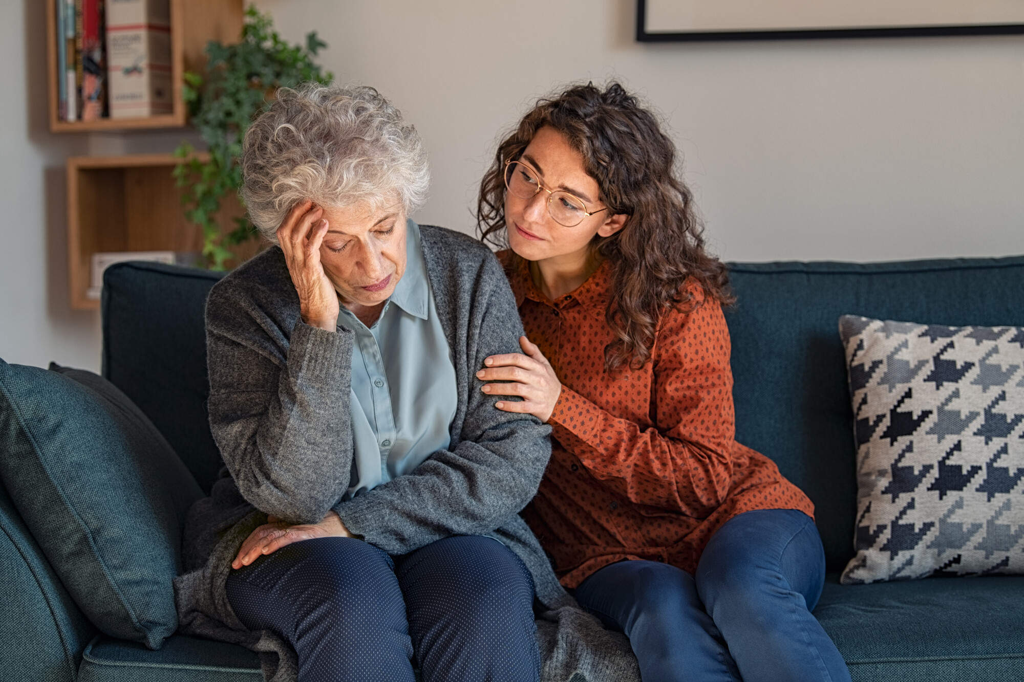 Worried Elderly Woman Consoled by Daughter