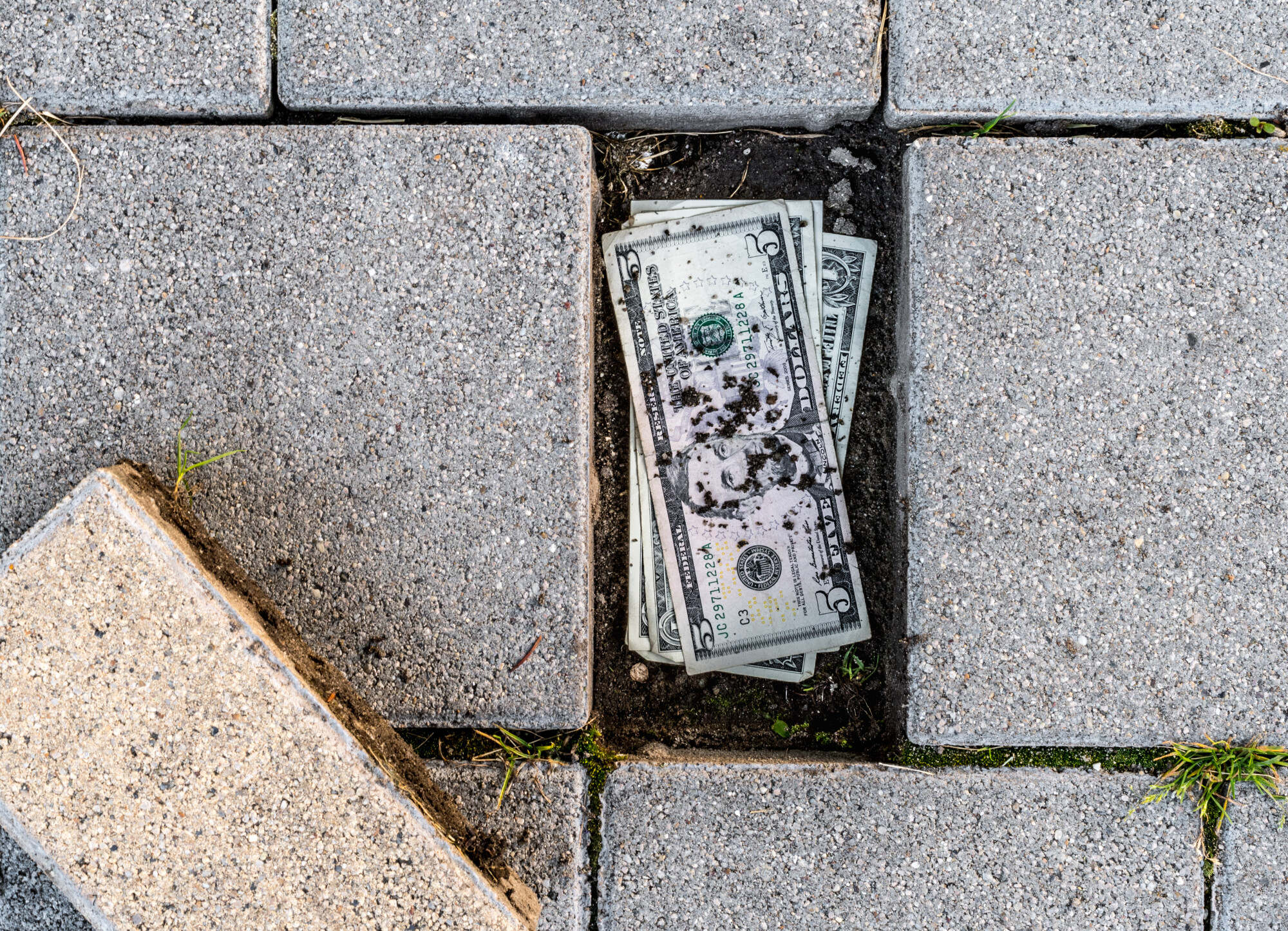 Money hidden under patio