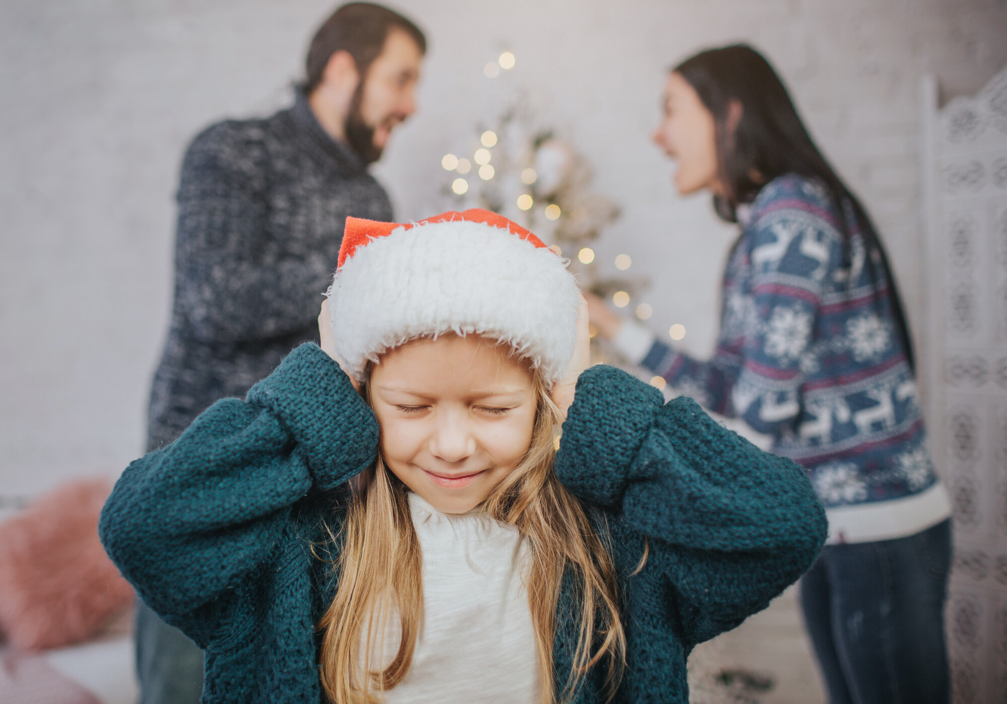 Couple arguing in front of child during holidays