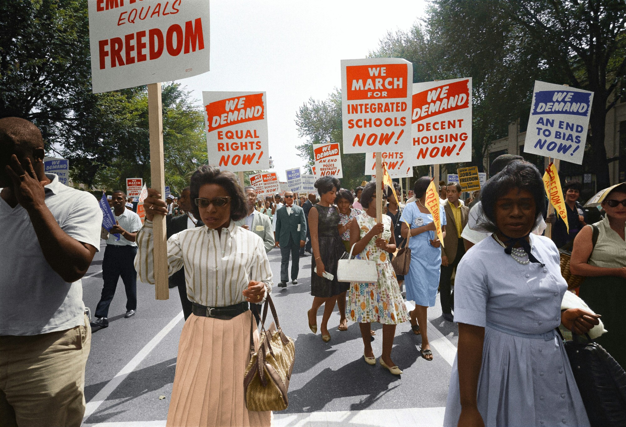 Civil rights protestors carrying signs.